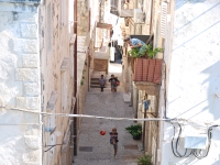 Croatia, Mlini 2017. The boys play soccer in old Dubrovnik