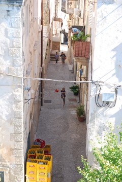 The boys play soccer in old Dubrovnik